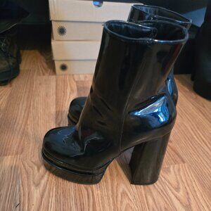 Gently worn patent platform boots